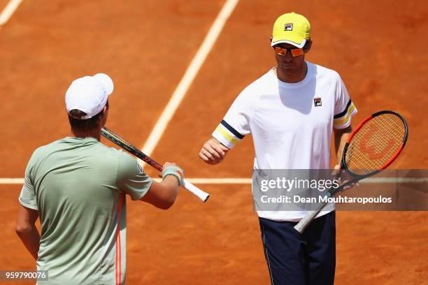 Henri Kontinen of Finland and John Peers of Australia speak in their quarter final match against Jamie Murray of Great Britain and Bruno Soares of...