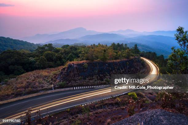 sunrise of road on the mountain at doi inthanon national park of chiang mai province thailand - chiang mai province stock-fotos und bilder