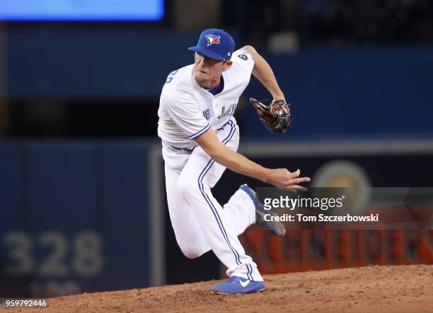 Tyler Clippard of the Toronto Blue Jays delivers a pitch in the ninth inning during MLB game action against the Boston Red Sox at Rogers Centre on...