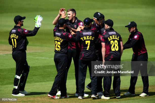 Craig Overton of Somerset celebrates with his teammates after dismissing Will Jacks of Surrey during the Royal London One-Day Cup match between...