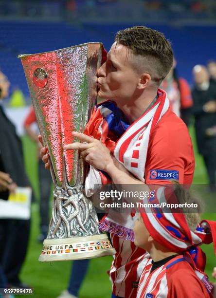 Kevin Gameiro of Atletico Madrid kisses the trophy after the UEFA Europa League Final between Olympique de Marseille and Club Atletico de Madrid at...