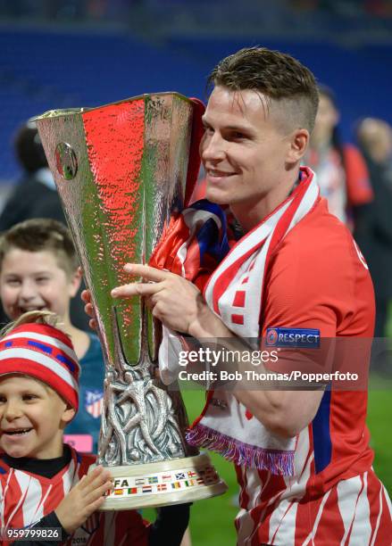 Kevin Gameiro of Atletico Madrid celebrates with the trophy after the UEFA Europa League Final between Olympique de Marseille and Club Atletico de...