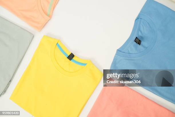 top view colourful t-shirt collage and compose - shirt no people foto e immagini stock