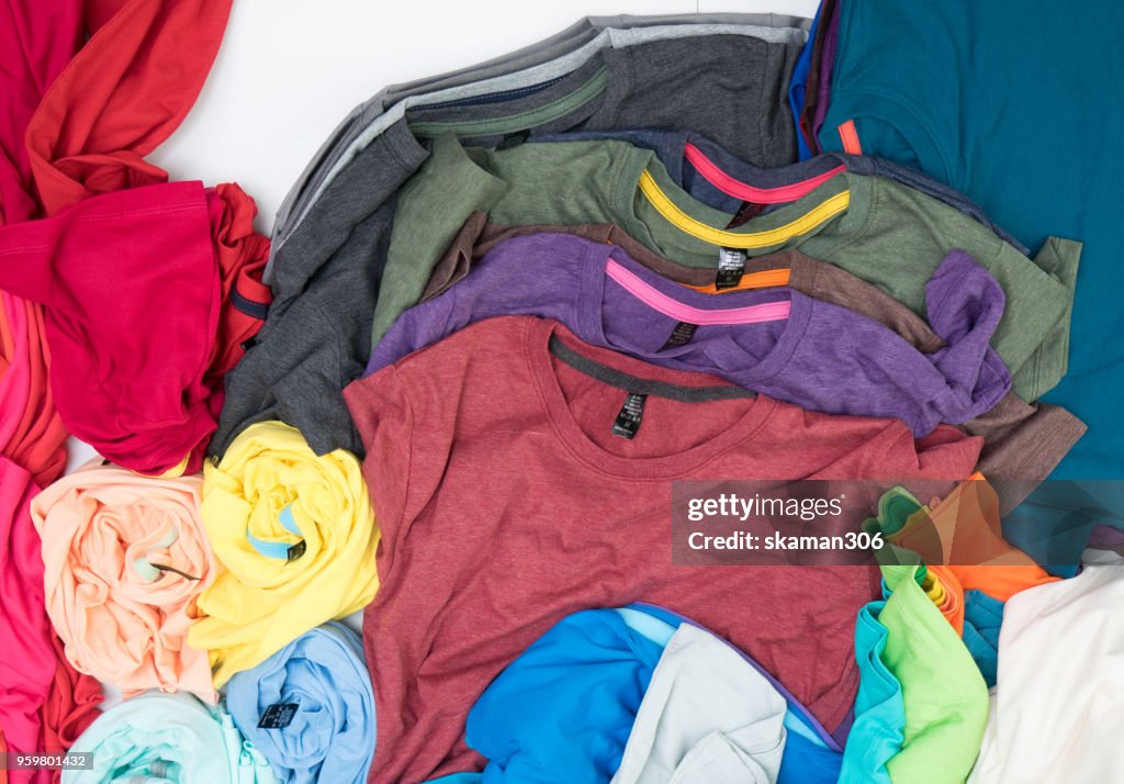 Top view colourful t-shirt collage and compose