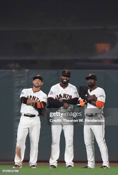 Gregor Blanco, Austin Jackson and Andrew McCutchen of the San Francisco Giants celebrates defeating the Cincinnati Reds 5-3 at AT&T Park on May 15,...