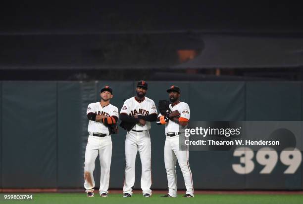 Gregor Blanco, Austin Jackson and Andrew McCutchen of the San Francisco Giants celebrates defeating the Cincinnati Reds 5-3 at AT&T Park on May 15,...