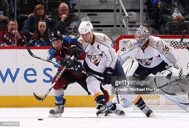 Brandon Yip of the Colorado Avalanche skates against Shae Weber of the Nashville Predators at the Pepsi Center on January 22, 2010 in Denver,...