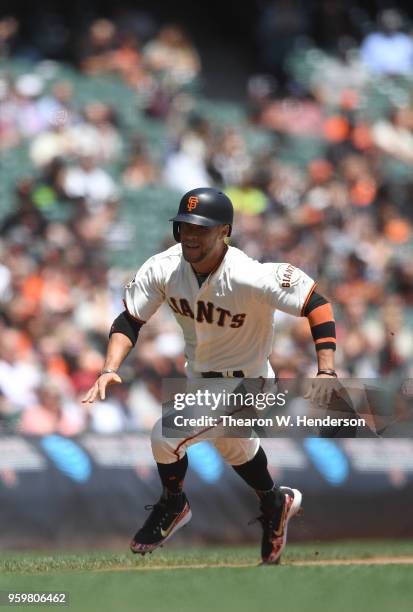 Gregor Blanco of the San Francisco Giants rounds third base to score on an rbi double from Andrew McCutchen against the Cincinnati Reds in the bottom...