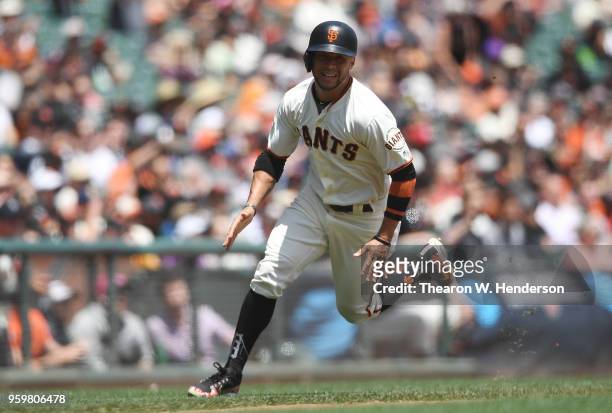 Gregor Blanco of the San Francisco Giants rounds third base to score on an rbi double from Andrew McCutchen against the Cincinnati Reds in the bottom...