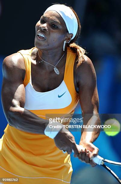Tennis player Serena Williams plays a backhand return during her third round women's singles match against Spanish opponent Carla Suarez Navarro at...