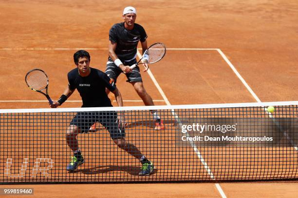 Lukasz Kubot of Poland and Marcelo Melo of Brazil compete in their quarter final doubles match against Juan Sebastian Cabal and Robert Farah both of...