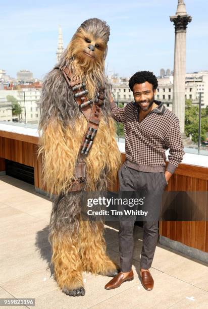 Donald Glover poses with Chewbacca for photographers at a photocall for Solo: A Star Wars Story at The Trafalgar Hotel on May 18, 2018 in London,...