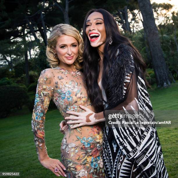 Paris Hilton and Winnie Harlow poses for portraits at the amfAR Gala Cannes 2018 cocktail at Hotel du Cap-Eden-Roc on May 17, 2018 in Cap d'Antibes,...