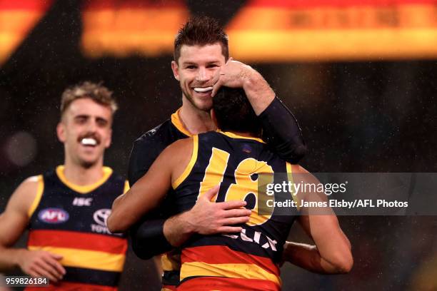 Bryce Gibbs and Eddie Betts of the Crows celebrate a goal during the 2018 AFL round nine match between the Adelaide Crows and the Western Bulldogs at...