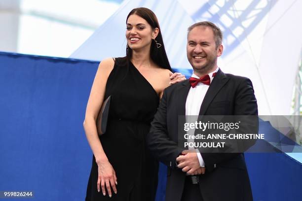 Russian actress Natalja Titarenko and Russian actor Sergey Mazur attend on May 18, 2018 a photocall for the film "Ayka " at the 71st edition of the...