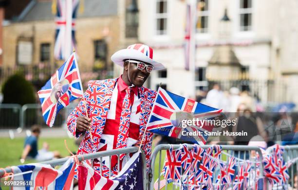 Royal fan waits on the Long Walk on May 18, 2018 in Windsor, England. Preparations continue in the town for the wedding between Prince Harry and Ms....