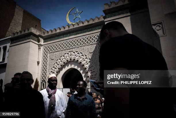 Muslims leave the Grande Mosquee de Paris in Paris on May 18, 2018 after the first Friday prayers of the holy month of Ramadan.