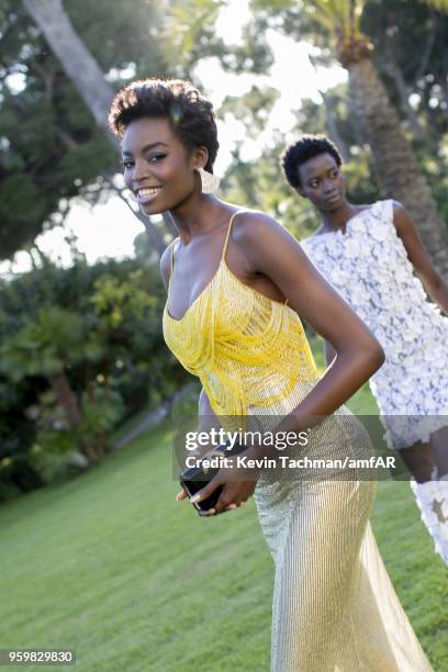 Maria Borges and Fatou Jobe attend the cocktail at the amfAR Gala Cannes 2018 at Hotel du Cap-Eden-Roc on May 17, 2018 in Cap d'Antibes, France.