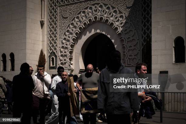 Muslims leave the Grande Mosquee de Paris in Paris on May 18, 2018 after the first Friday prayers of the holy month of Ramadan.