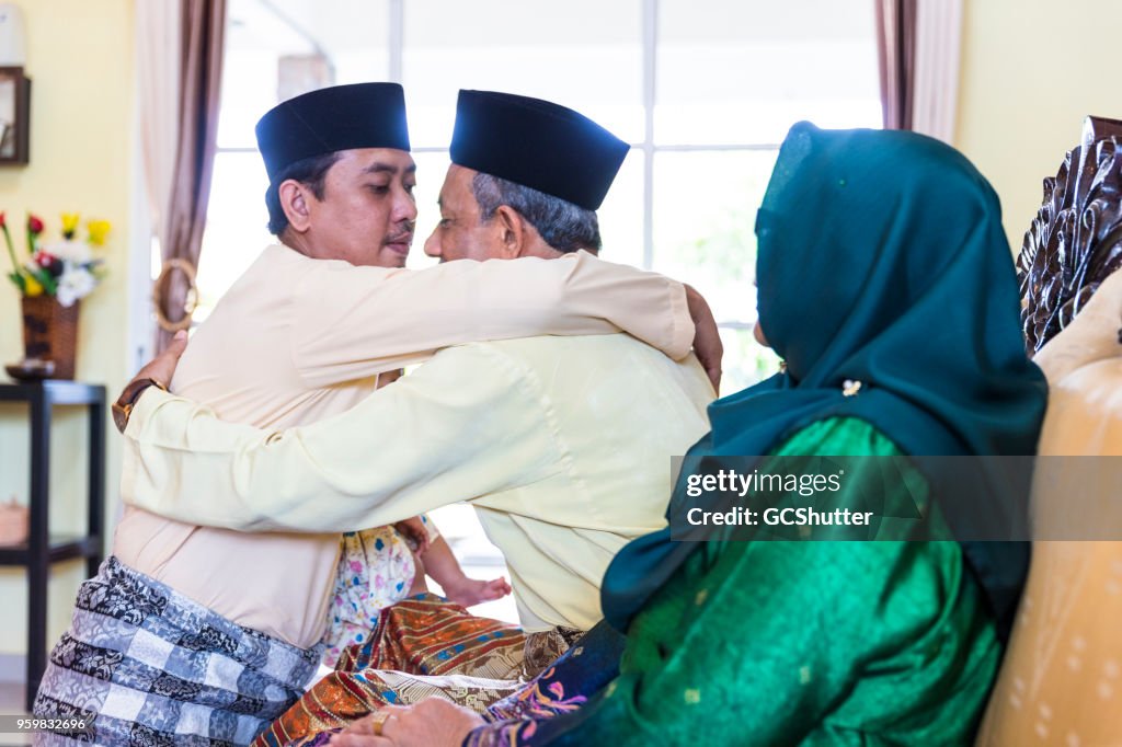 Father and Son hugging each other during a festive celebration