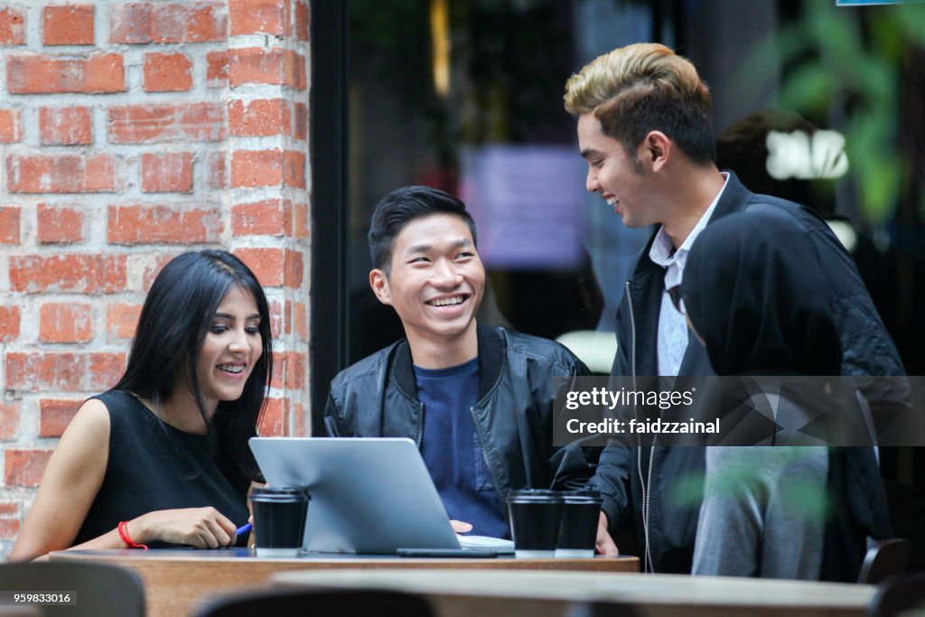 Casual Group Business Discussion at A Cafe / Restaurant