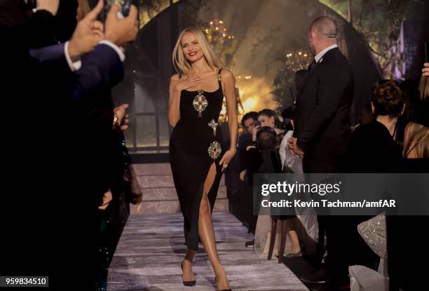 Natasha Poly walks the runway during the amfAR Gala Cannes 2018 fashion show at Hotel du Cap-Eden-Roc on May 17, 2018 in Cap d'Antibes, France.