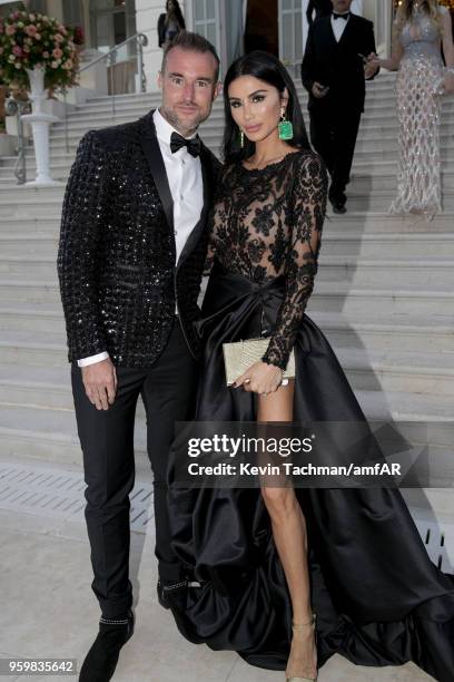 Philipp Plein and Morgan Osman attend the cocktail at the amfAR Gala Cannes 2018 at Hotel du Cap-Eden-Roc on May 17, 2018 in Cap d'Antibes, France.