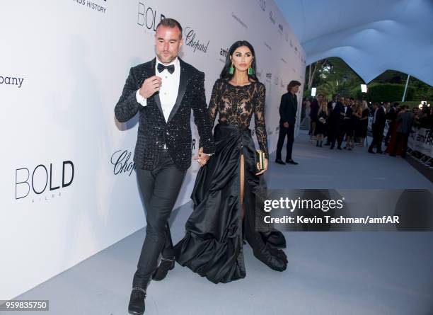 Philipp Plein and Morgan Osman arrive at the amfAR Gala Cannes 2018 at Hotel du Cap-Eden-Roc on May 17, 2018 in Cap d'Antibes, France.