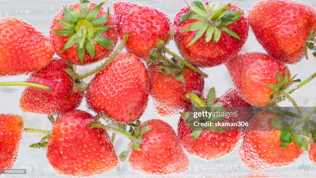 Fresh strawberry with water splash