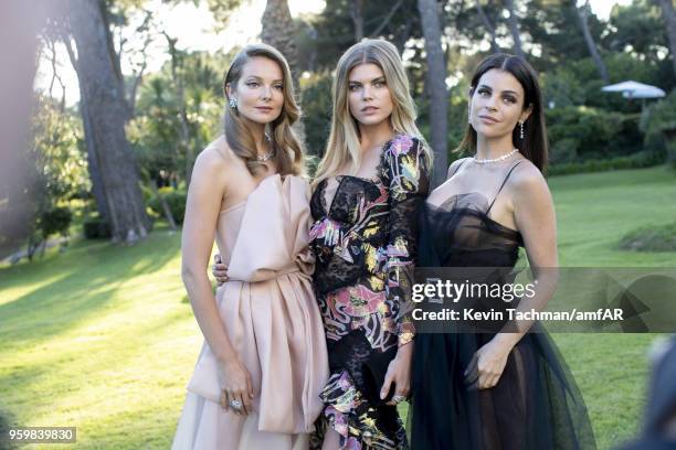 Eniko Mihalik, Maryna Linchuk and Julia Restoin Roitfeld attend the cocktail at the amfAR Gala Cannes 2018 at Hotel du Cap-Eden-Roc on May 17, 2018...