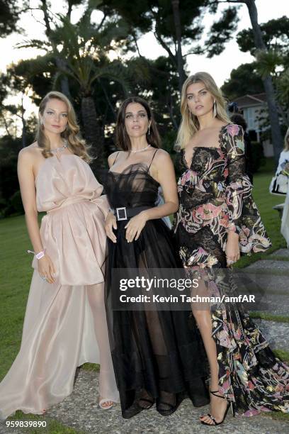 Eniko Mihalik, Julia Restoin Roitfeld and Maryna Linchuk attend the cocktail at the amfAR Gala Cannes 2018 at Hotel du Cap-Eden-Roc on May 17, 2018...