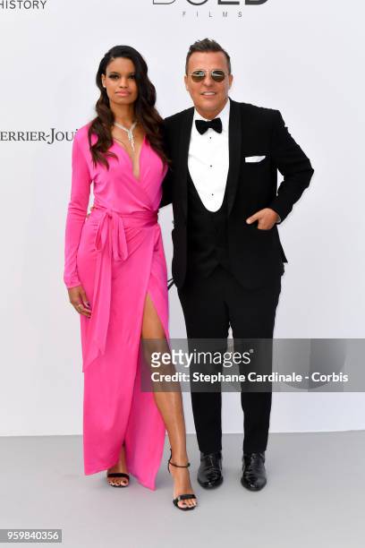 Anais Monory and Jean Roch arrive at the amfAR Gala Cannes 2018 at Hotel du Cap-Eden-Roc on May 17, 2018 in Cap d'Antibes, France.