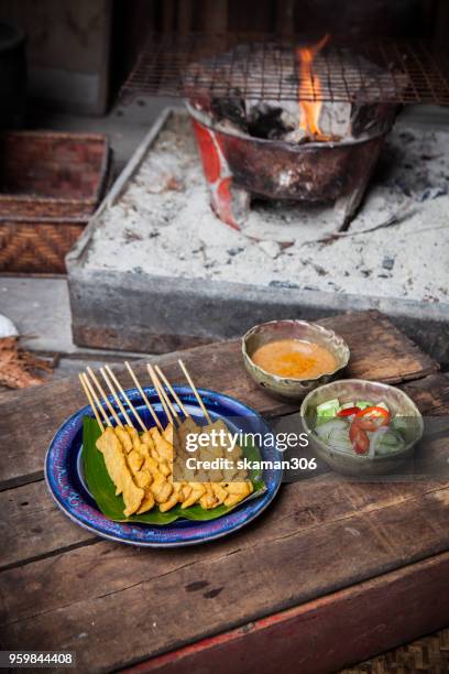 chicken satay grilled on grills plate with smoke - chicken satay stock pictures, royalty-free photos & images