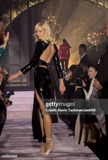 Karolina Kurkova walks the runway during the amfAR Gala Cannes 2018 fashion show at Hotel du Cap-Eden-Roc on May 17, 2018 in Cap d'Antibes, France.