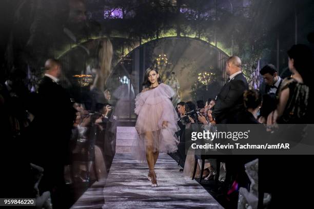 Georgia Fowler walks the runway during the amfAR Gala Cannes 2018 fashion show at Hotel du Cap-Eden-Roc on May 17, 2018 in Cap d'Antibes, France.