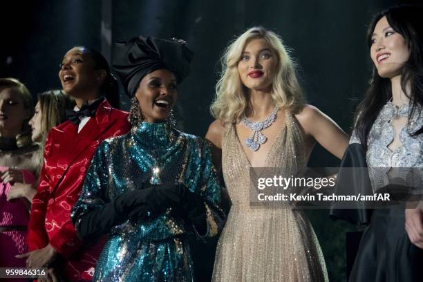 Halima Aden and Elsa Hosk on stage at the amfAR Gala Cannes 2018 at Hotel du Cap-Eden-Roc on May 17, 2018 in Cap d'Antibes, France.
