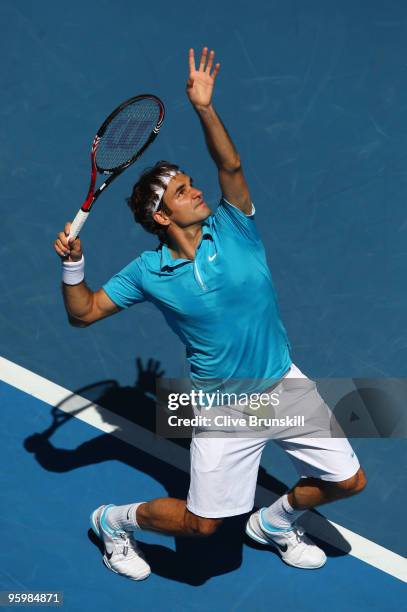 Roger Federer of Switzerland serves in his third round match against Albert Montanes of Spain during day six of the 2010 Australian Open at Melbourne...