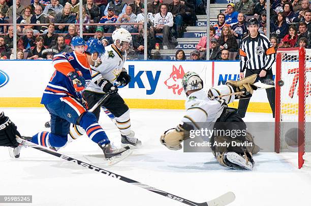 Sam Gagner of the Edmonton Oilers puts the puck past a sprawling Marty Turco of the Dallas Stars for a second period goal on January 22, 2010 at...