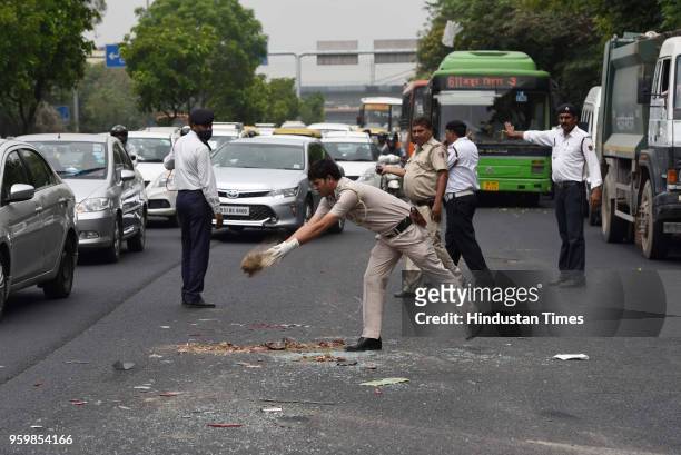 Delhi Police officials at the site of the accident where an Indian Oil tanker mowed down a motorcyclist and hit several cars on Friday morning at...