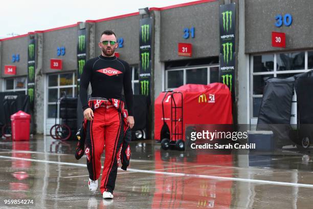 Austin Dillon, driver of the Dow Chevrolet, walks to his hauler during a rain delay during practice for the Monster Energy NASCAR Cup Series All-Star...