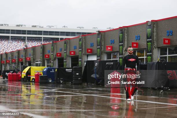 Austin Dillon, driver of the Dow Chevrolet, walks to his hauler during a rain delay during practice for the Monster Energy NASCAR Cup Series All-Star...