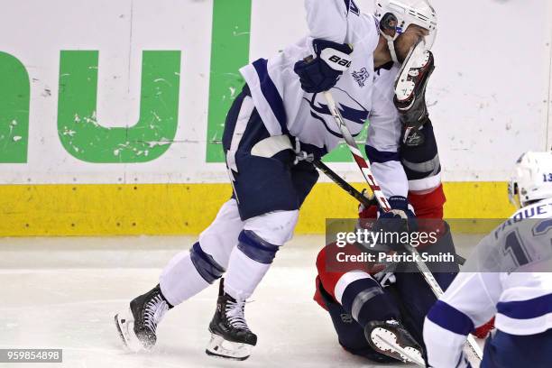 Chris Kunitz of the Tampa Bay Lightning gets kicked in the face against the Washington Capitals during the third period in Game Four of the Eastern...