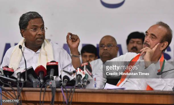 Congress senior leader and the leader of the opposition Rajya Sabha Ghulam Nabi Azad and outgoing Chief Minister of Karnataka, Siddaramaiah share a...