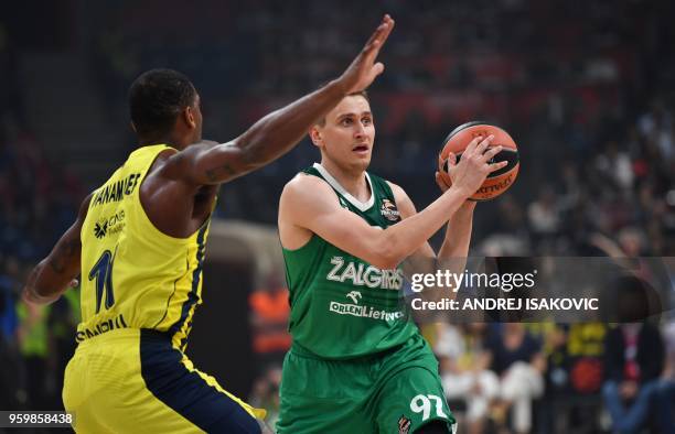 Fenerbahce's Brad Wanamaker vies for the ball with Zalgiris' Edgaras Ulanovas during the first semi-final EuroLeague Final Four basketball match...