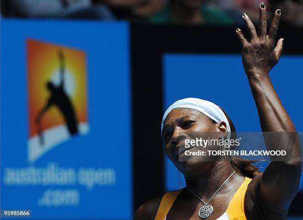 Tennis player Serena Williams gestures during her third round women's singles match against Spanish opponent Carla Suarez Navarro at the Australian...