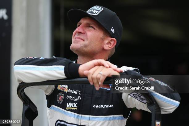 Clint Bowyer, driver of the Stewart-Haas Racing Fan Club Ford, looks on from the garage area during practice for the Monster Energy NASCAR Cup Series...