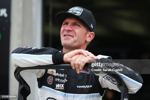 Clint Bowyer, driver of the Stewart-Haas Racing Fan Club Ford, looks on from the garage area during practice for the Monster Energy NASCAR Cup Series...