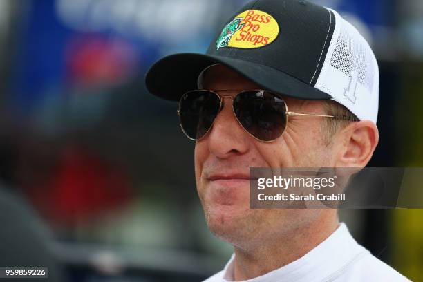 Jamie McMurray, driver of the Bass Pro Shops/Tracker Boats Chevrolet, stands in the garage during practice for the Monster Energy NASCAR Cup Series...