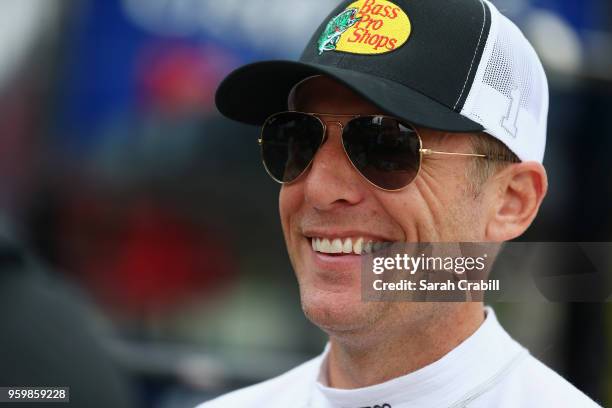 Jamie McMurray, driver of the Bass Pro Shops/Tracker Boats Chevrolet, stands in the garage during practice for the Monster Energy NASCAR Cup Series...