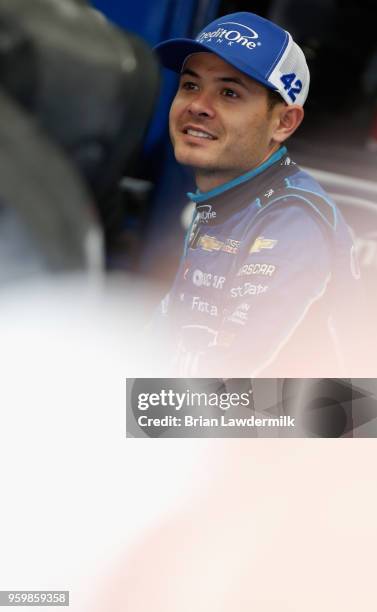 Kyle Larson, driver of the Credit One Bank Chevrolet, stands in the garage during practice for the Monster Energy NASCAR Cup Series All-Star Race at...